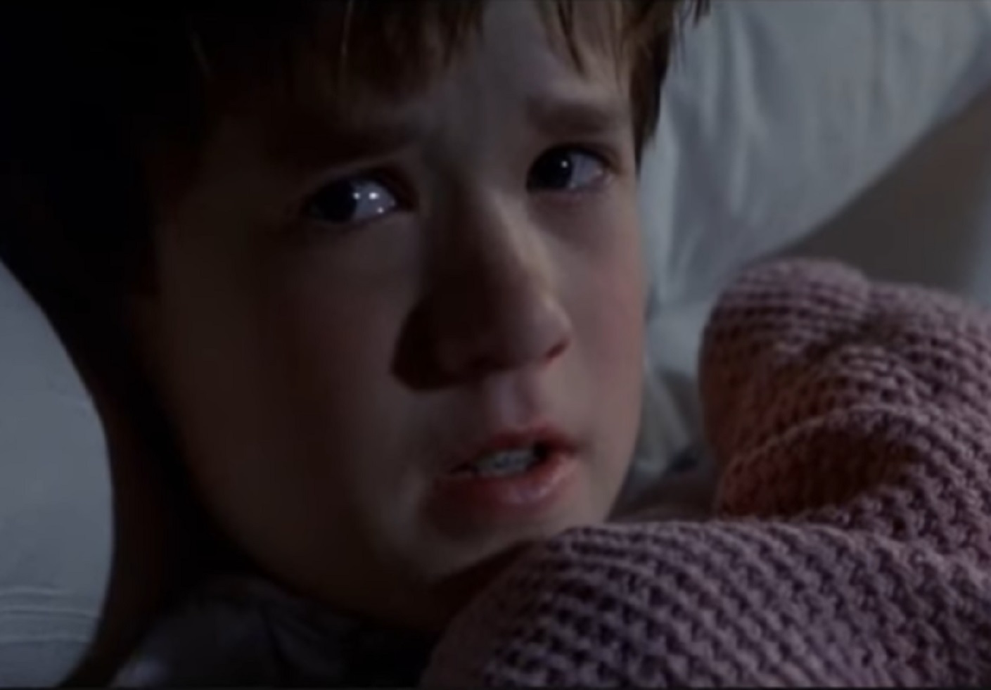 Screenshot of Haley Joel Osment looking upset - from The Sixth Sense (1999)