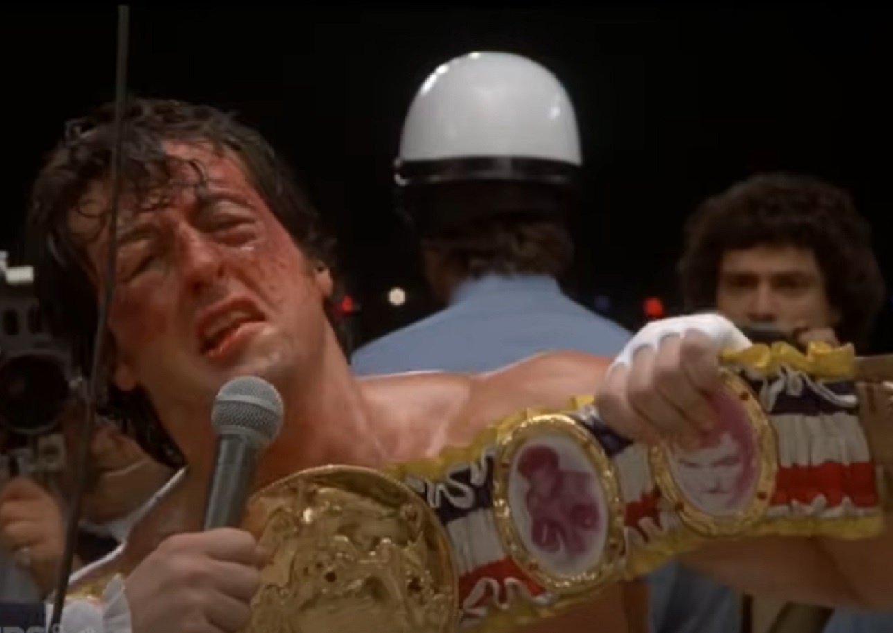 Screenshot of Sylvester Stallone talking in ring - from Rocky (1976)
