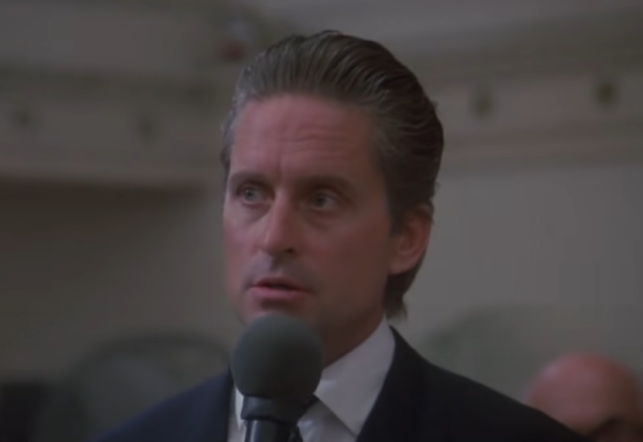 Screenshot of Michael Douglas looking at side - from Wall Street (1987)