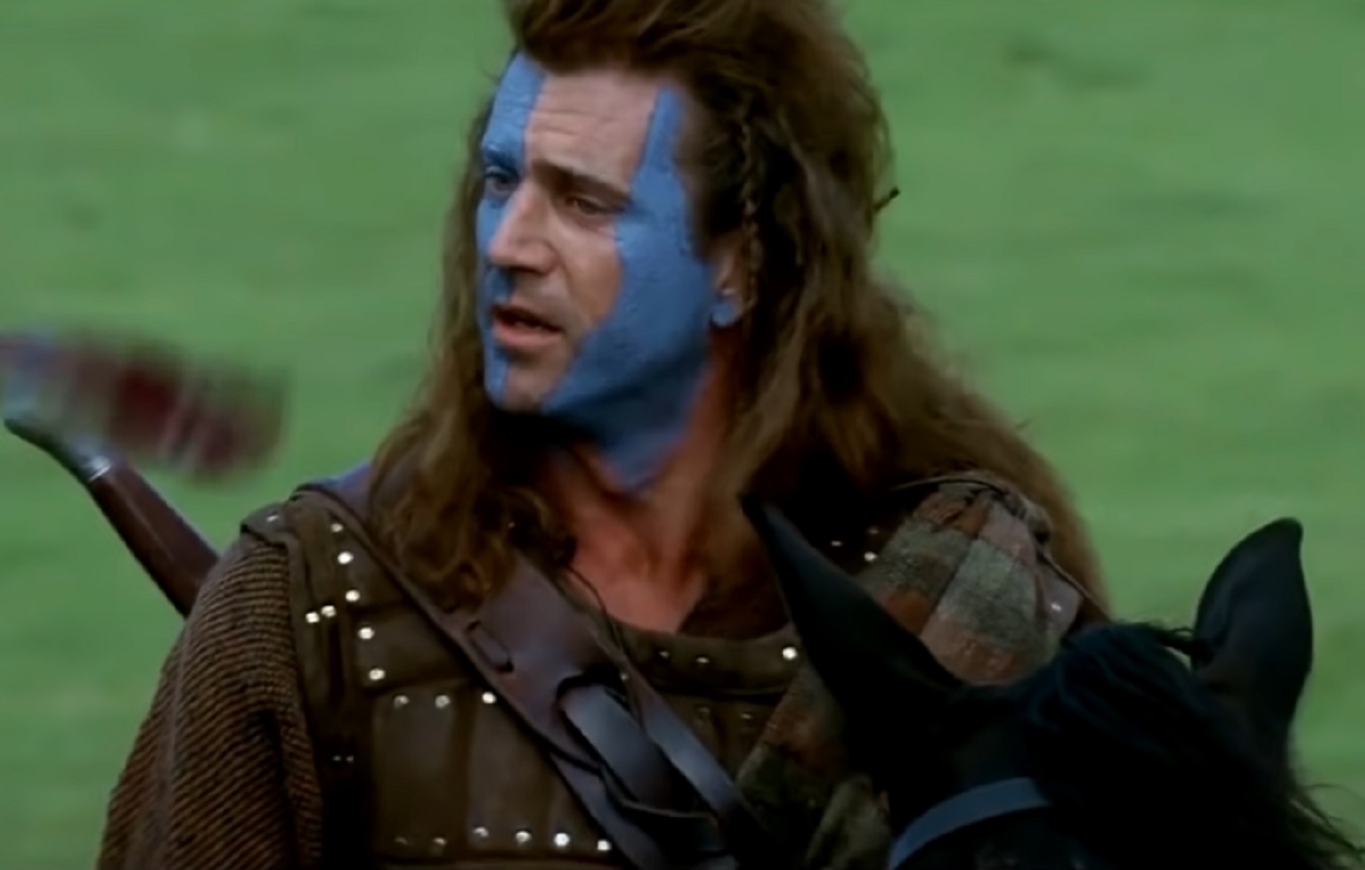 Screenshot of Mel Gibson looking at side - from Braveheart (1995)