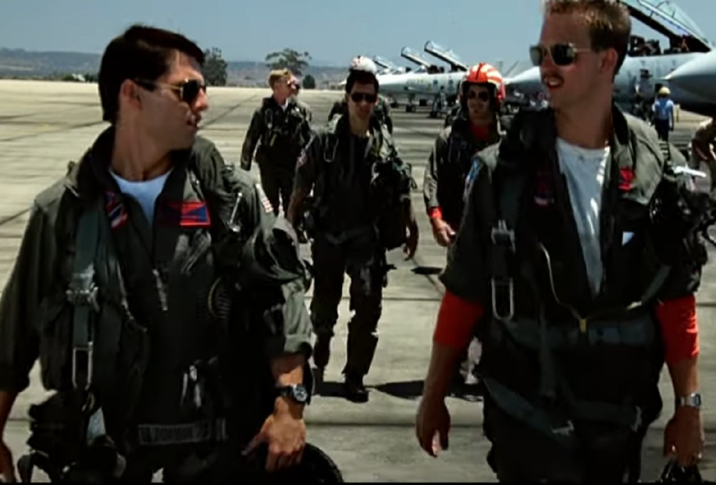 Screenshot of Tom Cruise looking at side  - from Top Gun (1986)
