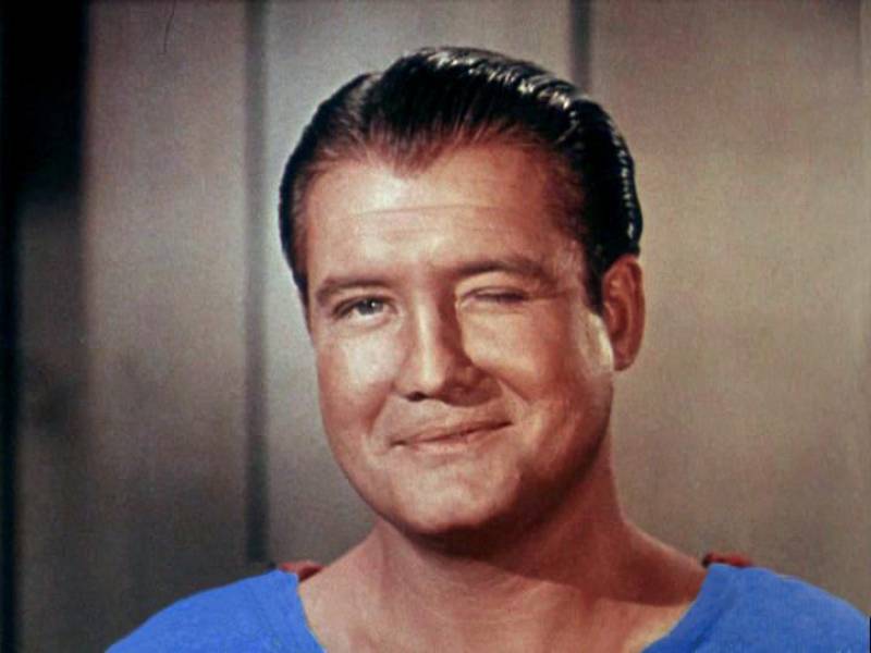 George Reeves in Superman costume looking at the camera