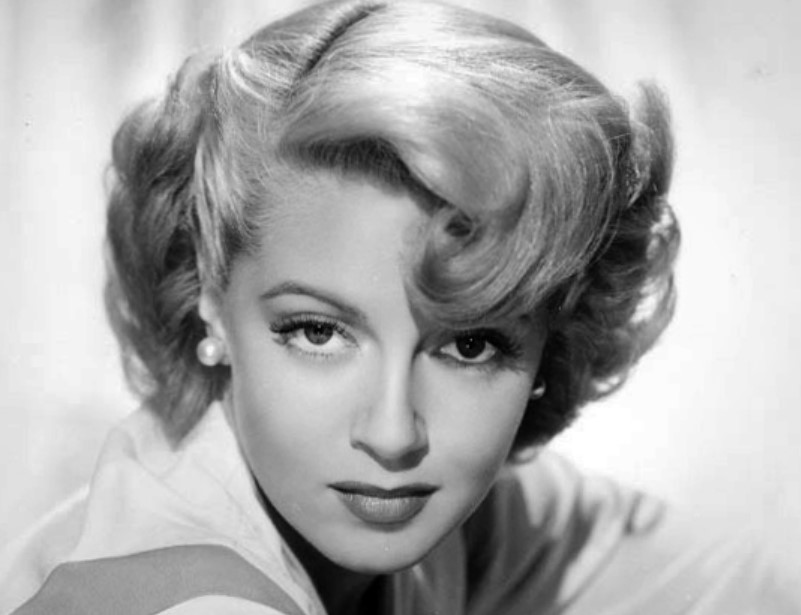 Publicity photo of Lana Turner in gray shirt