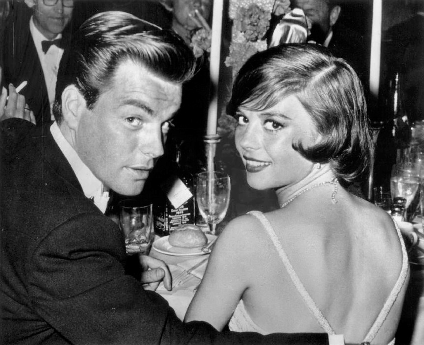 Robert Wagner and Natalie Wood  sitting at table