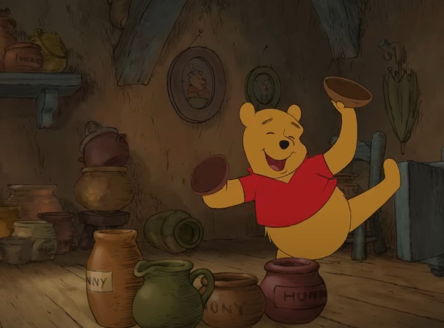 Winnie-the-Pooh bear eating honey