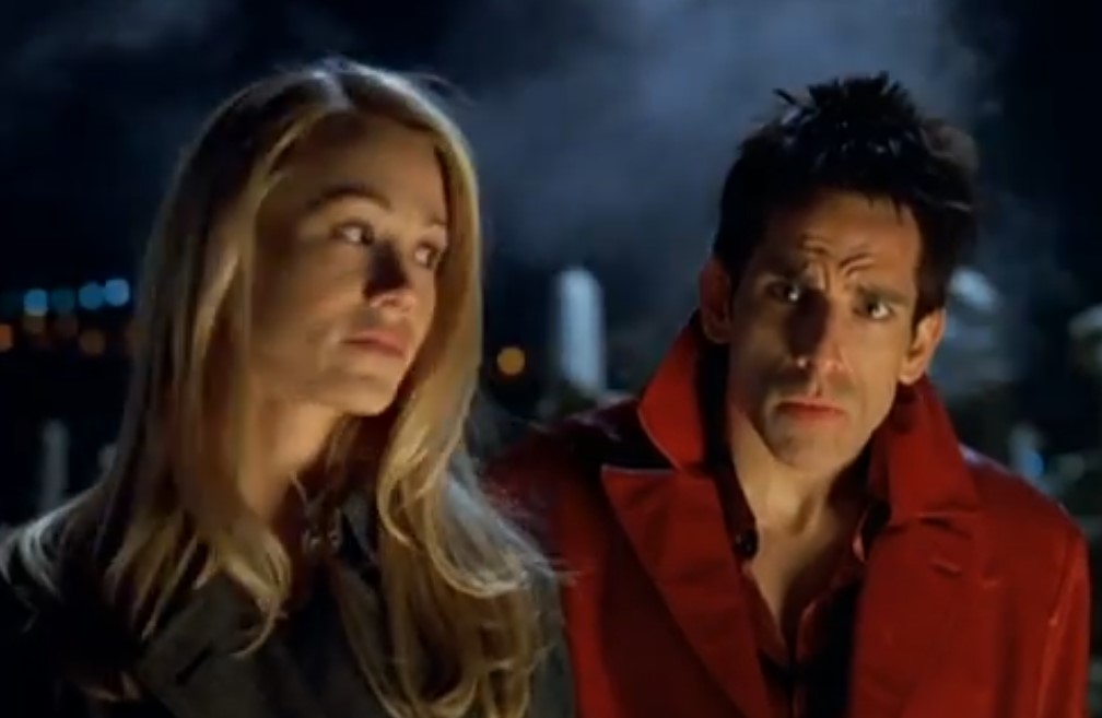 Man wearing red and blond girl talking