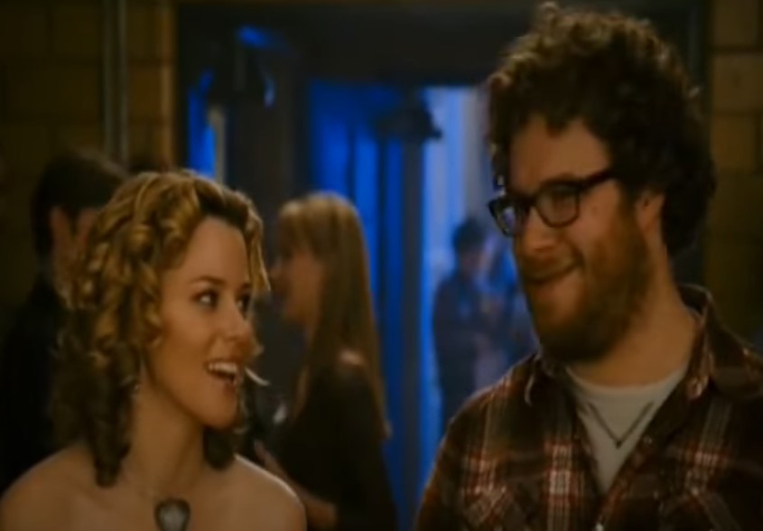 Image of a man and woman at a party talking