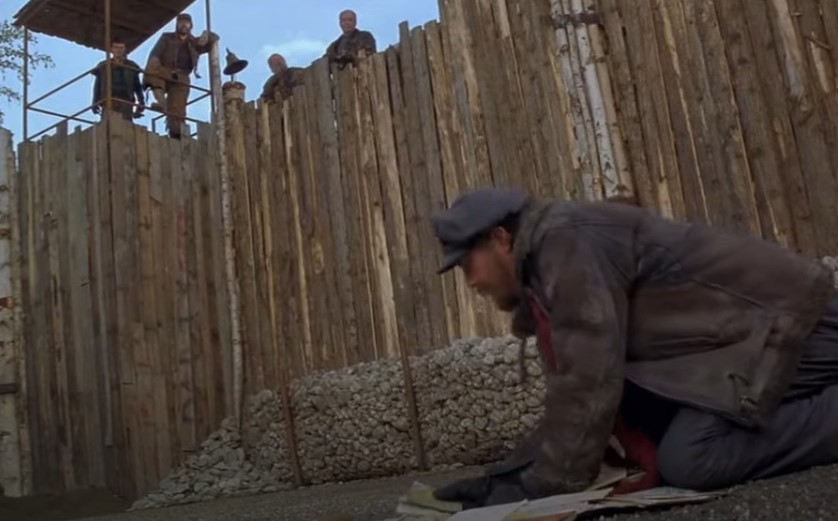 man searching for a post mail on the ground