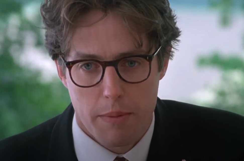 image of a man in a suit speaking