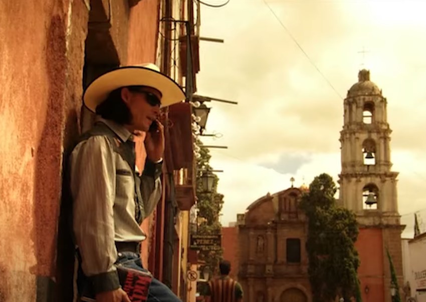 image of a man wearing a hat and book
