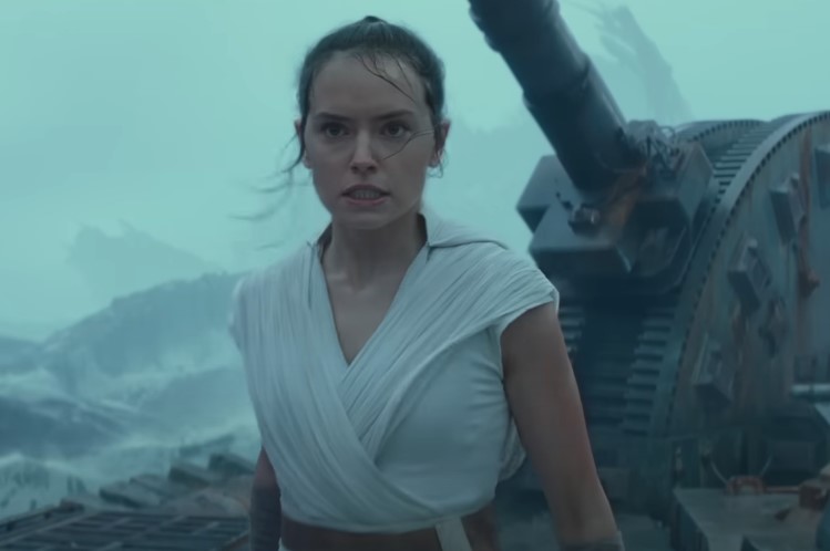 image of a girl standing in front of some metal object