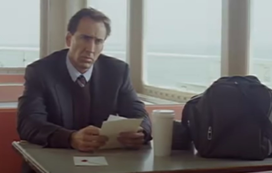 image of Nicolas Cage sitting in a train