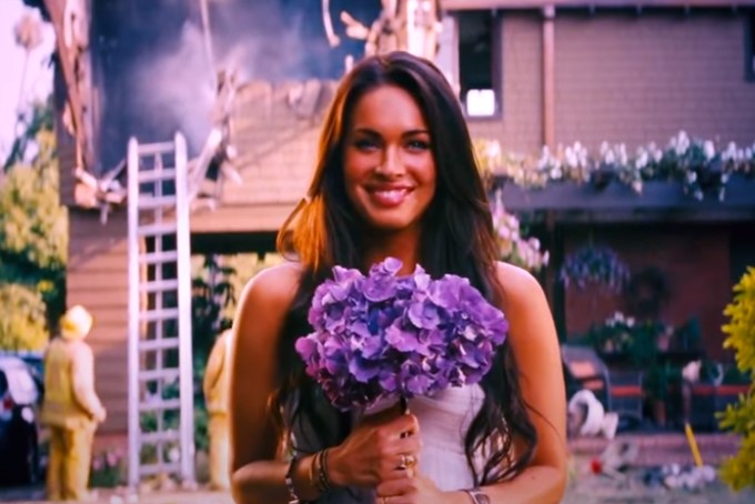 image of Megan Fox holding flowers