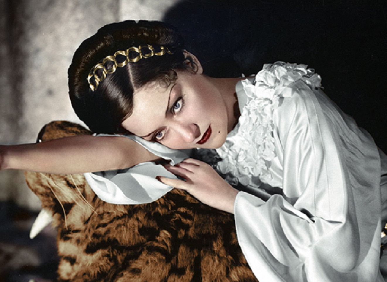 Portrait of Gloria Swanson laying.