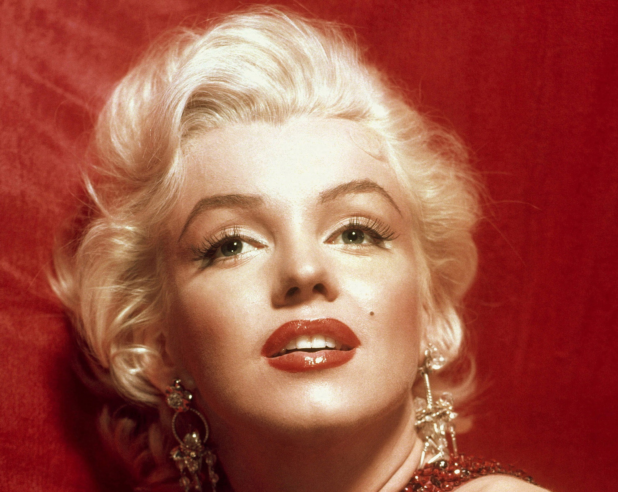 Marilyn Monroe in a red dress, taken for publicity purposes for 1953