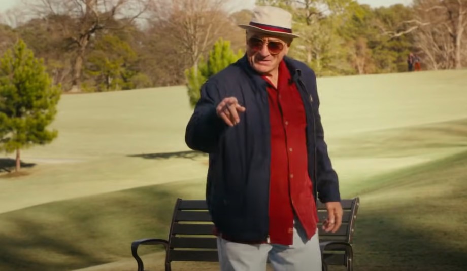 Robert De Niro in Dirty Grandpa (2016) in red shirt and blue jacket pointing