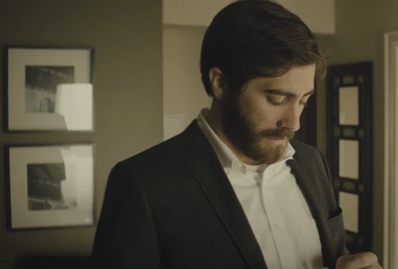 Jake Gyllenhaal in Enemy (2013) wearing a suit