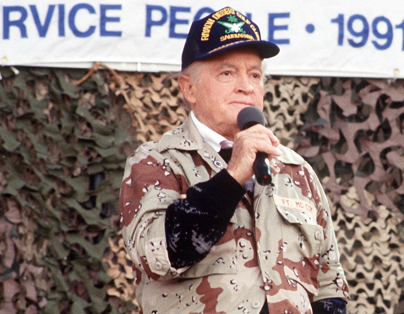 Entertainers Bob Hope perform for military personnel at the USO Christmas Tour