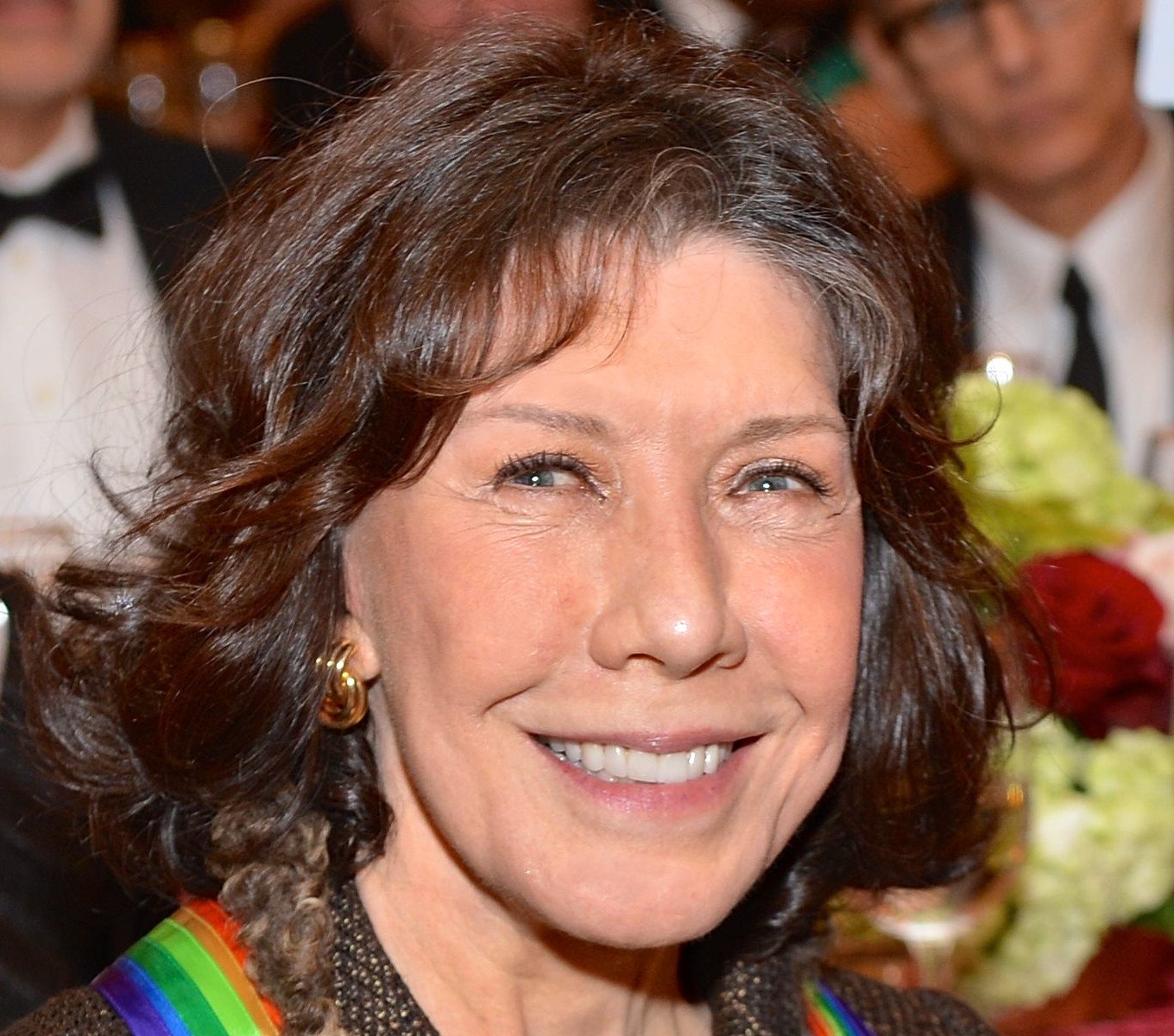 Comedienne Lily Tomlin smiles after receiving her Kennedy Center Honors medallion