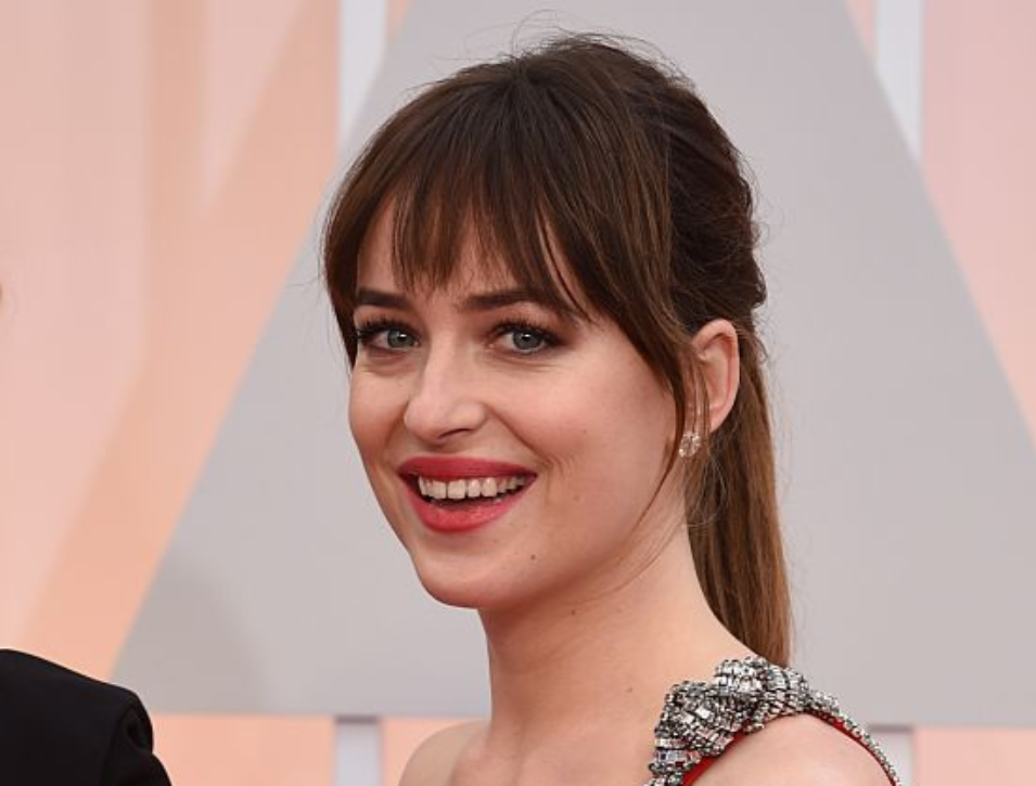Dakota Johnson (R) arrives with Melanie Griffith on the red carpet