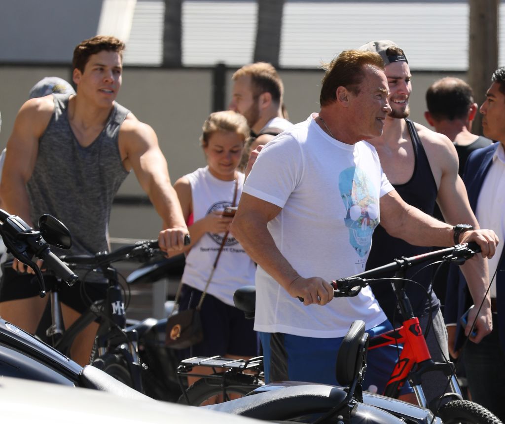 Arnold Schwarzenegger (R) and his son Joseph Baena