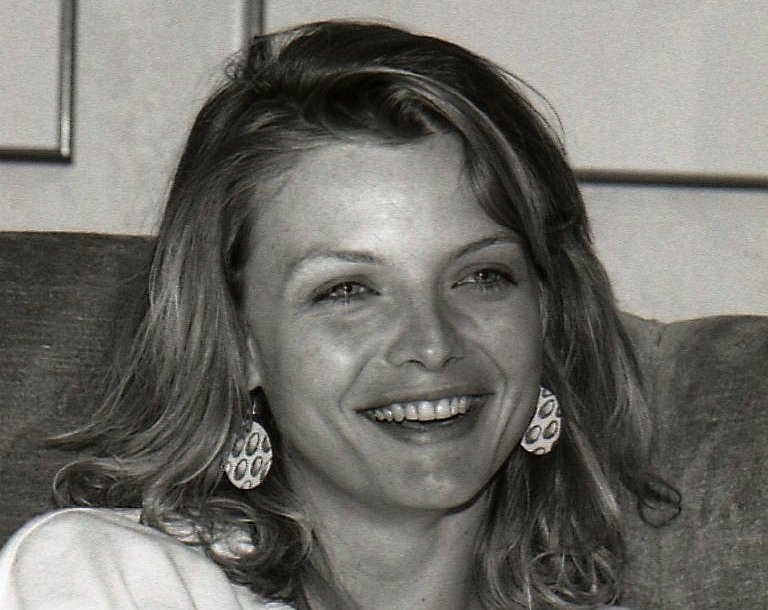 Grayscale Portrait Photo of The Actress Michelle Pfeiffer smiling