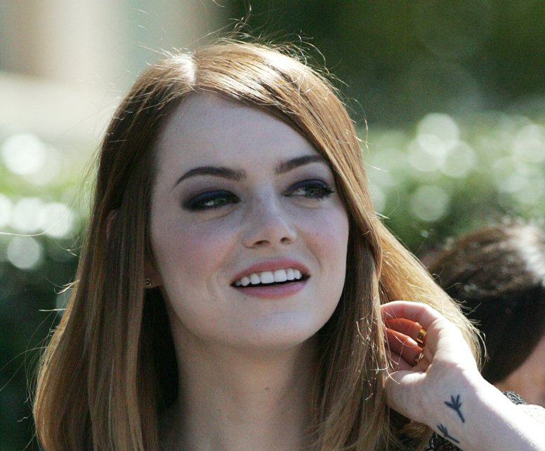 Portrait Photo of Emma Stone arrives at the premiere of