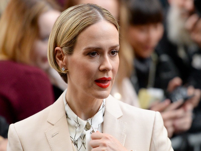 Portrait Photo of the Actress Sarah Paulson in beige outfit looking to the right