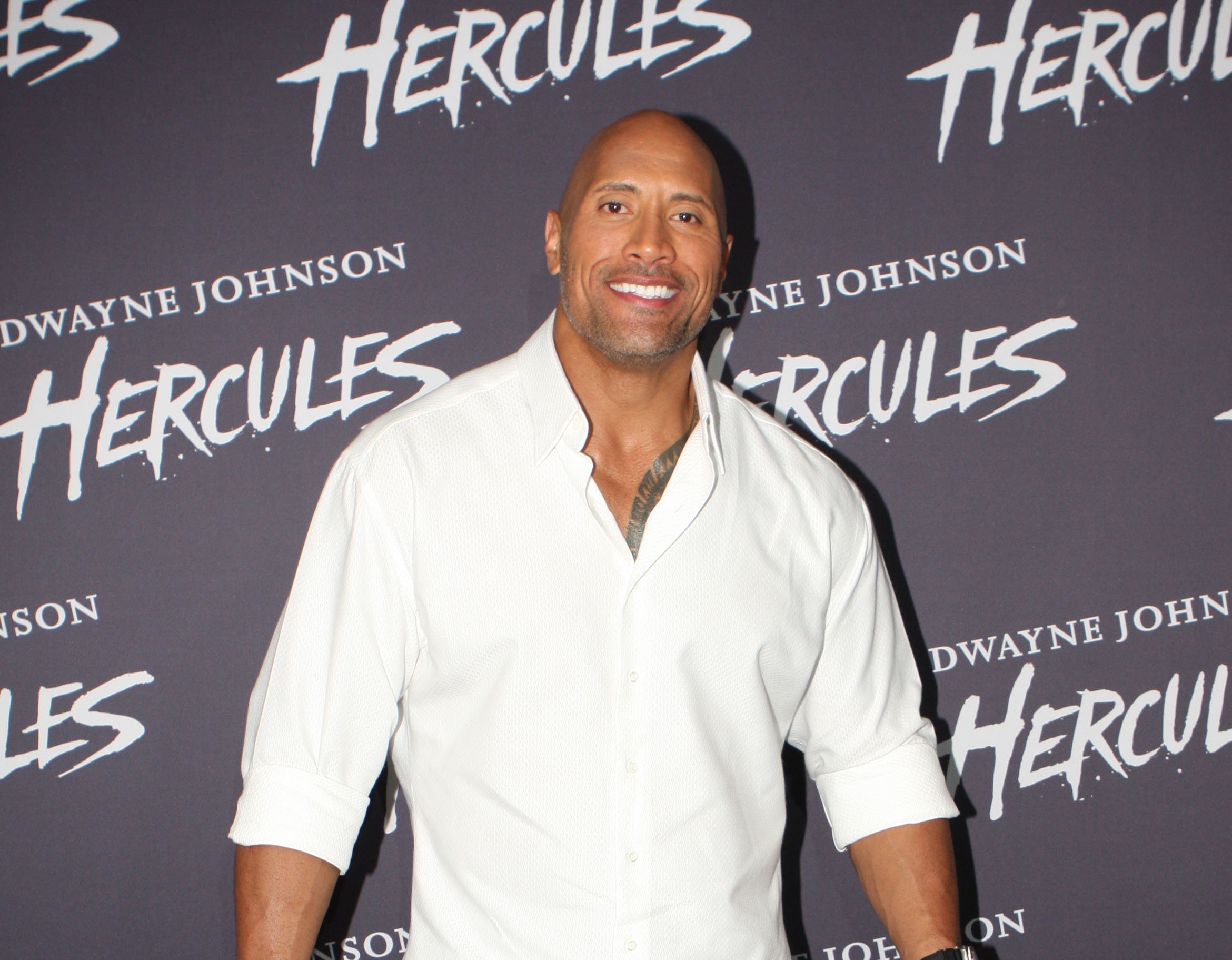 Portrait Photo of the Actor Dwayne Johnson in a white shirt, smiling