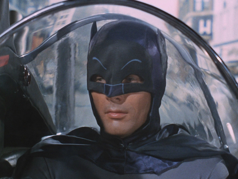 Portrait Photo of the actor Adam West portraying Batman.
