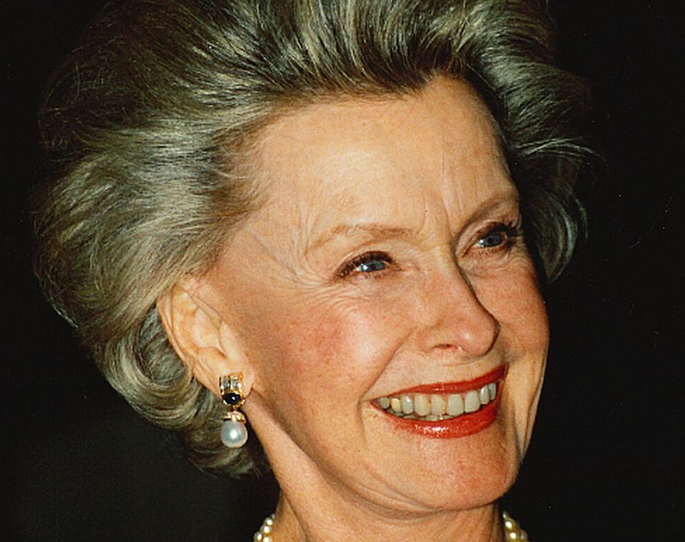 Dina Merrill looking at side and smiling - 1999