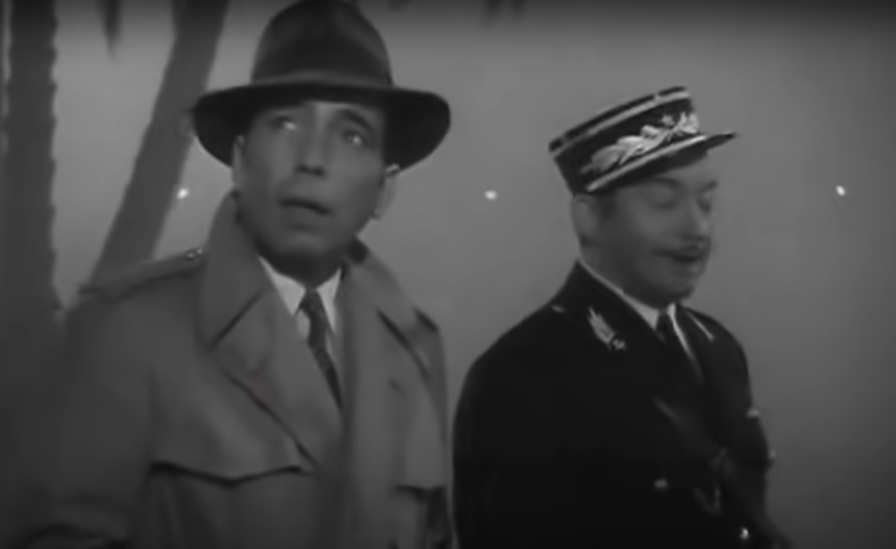 two men talking in Casablanca scene