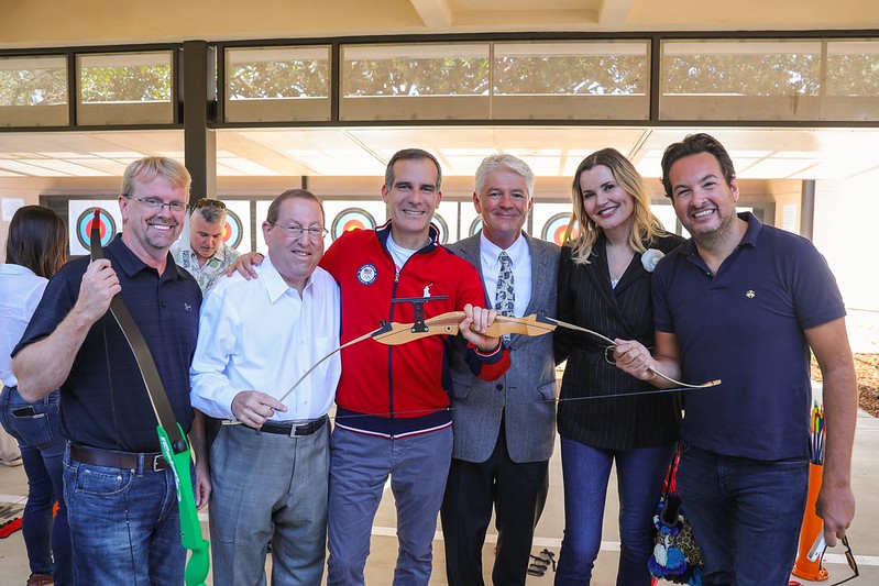Actress Geena Davis posing at archery club.