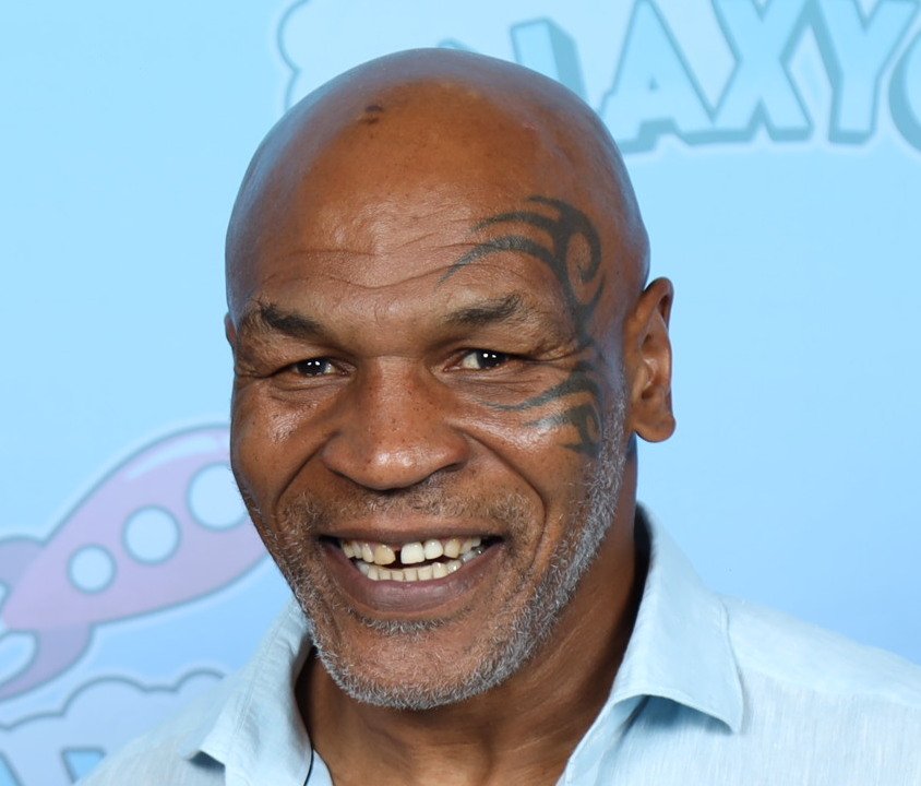 Portrait Photo of Mike Tyson in light blue shirt at GalaxyCon Austin