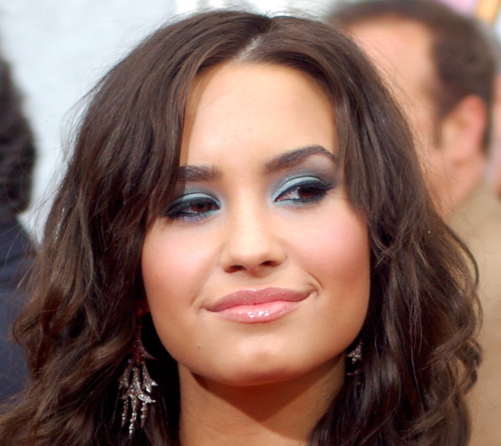 Portrait Photo of Demi Lovato at the premiere for Hannah Montana: The Movie