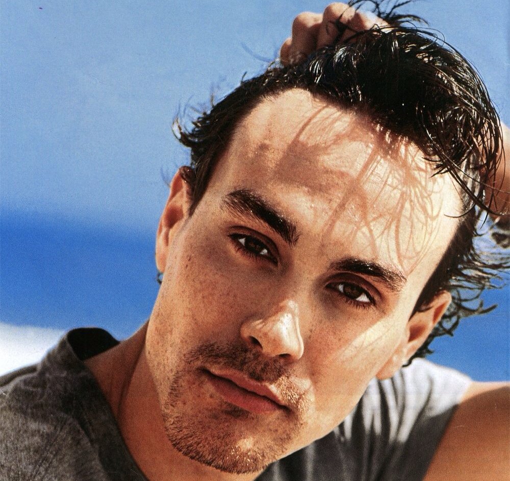 Portrait Photo of the Actor Brandon Lee in a gray t-shirt