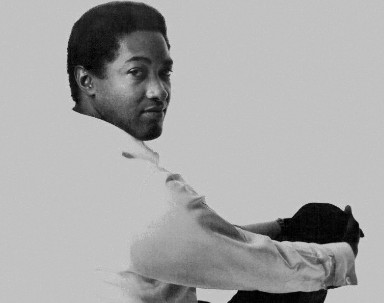 Grayscale Portrait Photo of Photo of singer Sam Cooke in white outfit