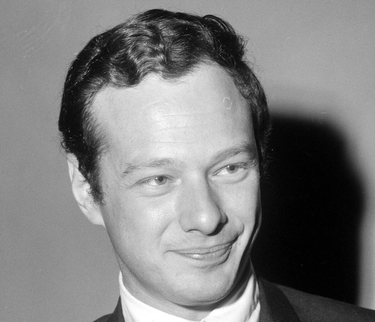 Grayscale Portrait Photo of Brian Epstein in a gray suit