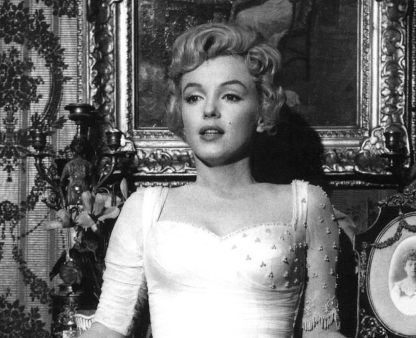 Grayscale Portrait Photo of Marilyn Monroe in a whit dress
