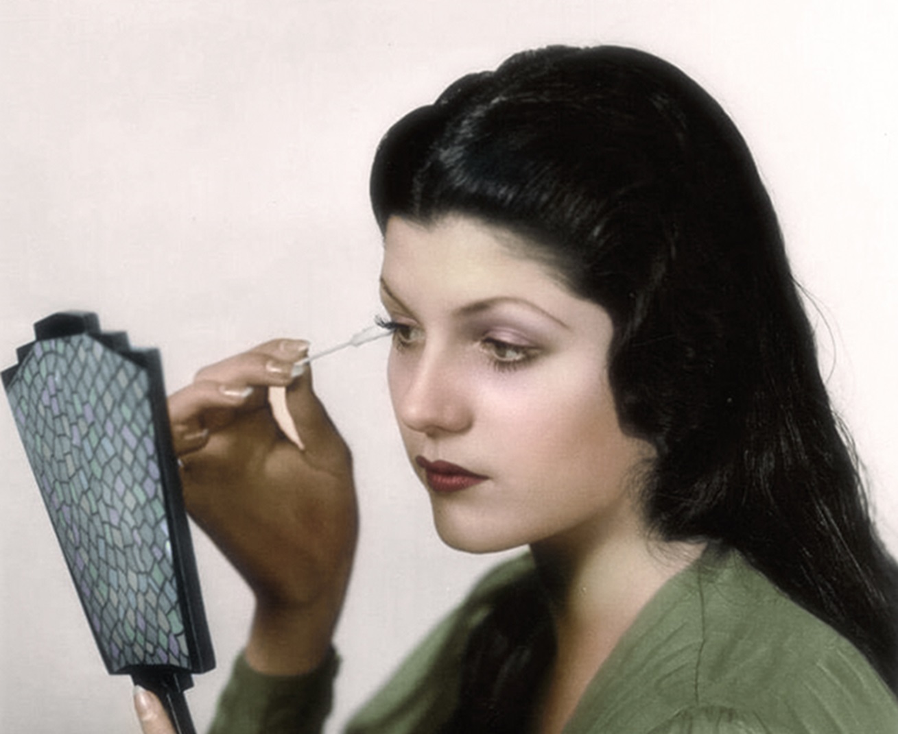 Rita Hayworth looking at mirror - age 17