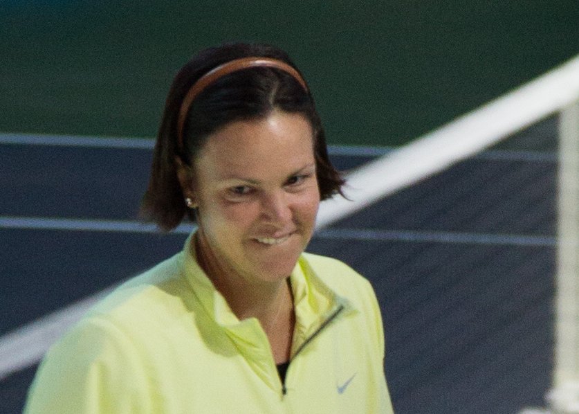 Portrait Photo of Lindsay Davenport in a yellow shirt, smiling