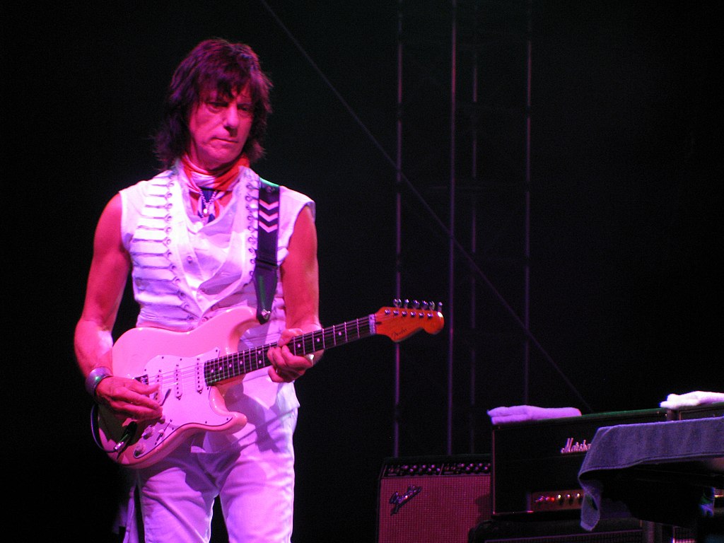 Portrait Photo of Jeff Beck performing on stage.