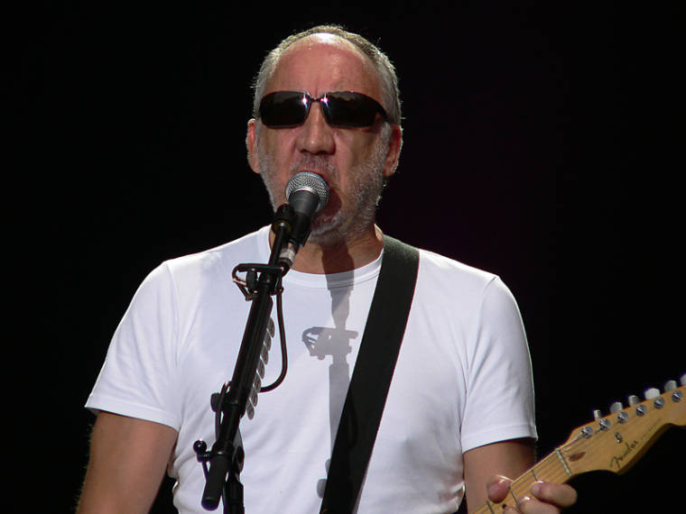 Portrait Photo of Pete Townshend performing on stage.