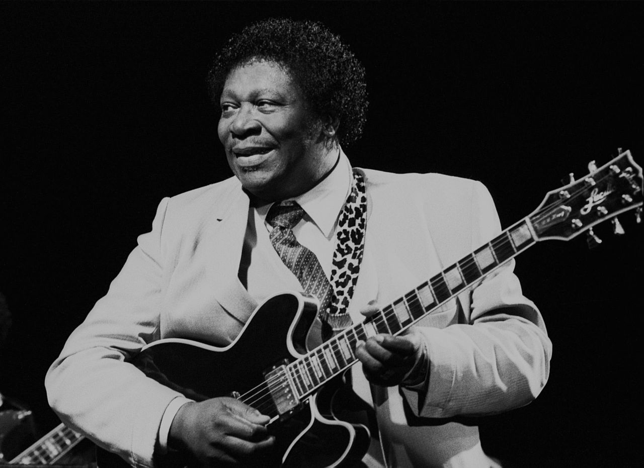 Grayscale Portrait Photo of B.B. King holding his Guitar