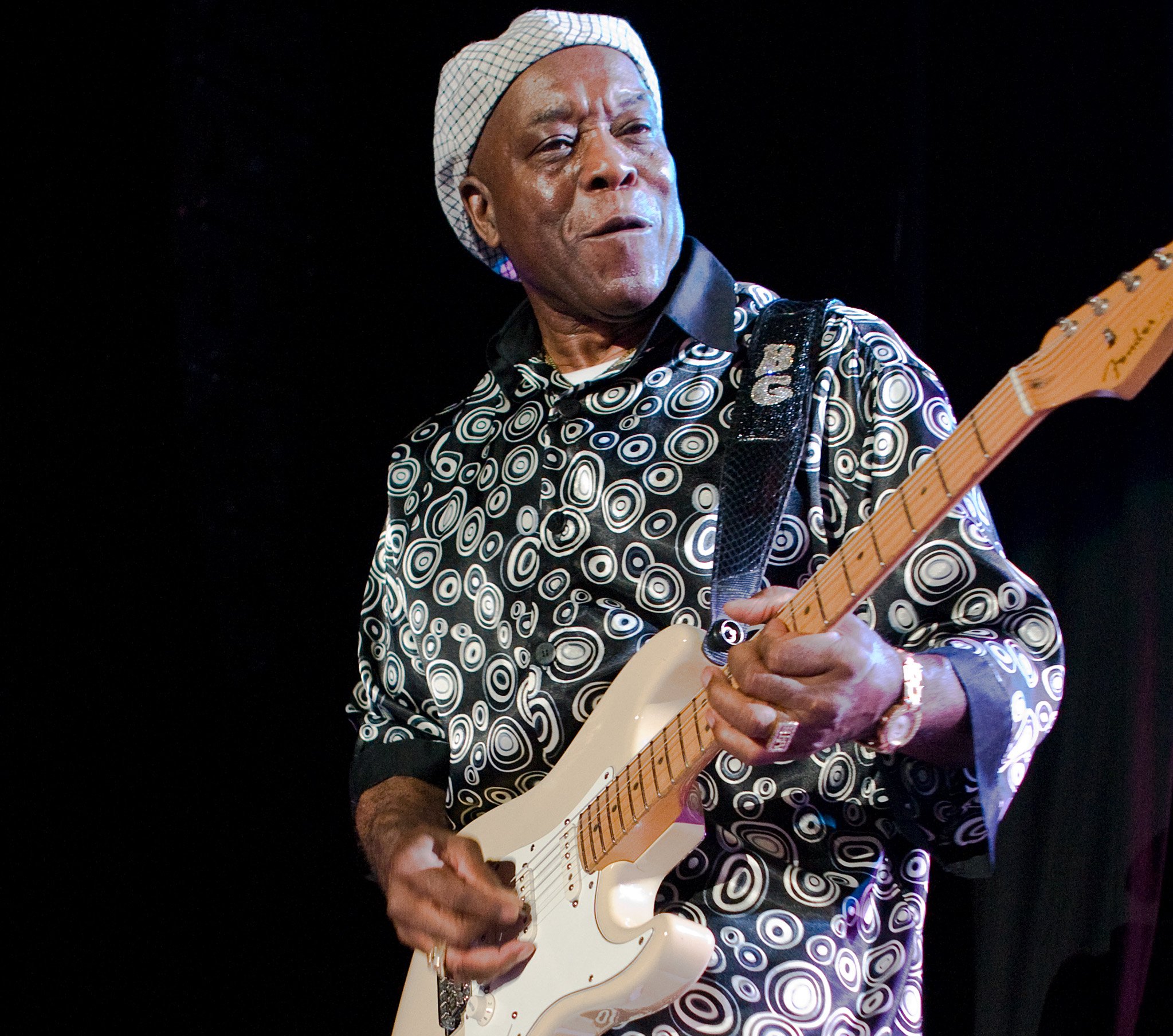 Portrait Photo of Buddy Guy performing on stage with his Stratocaster
