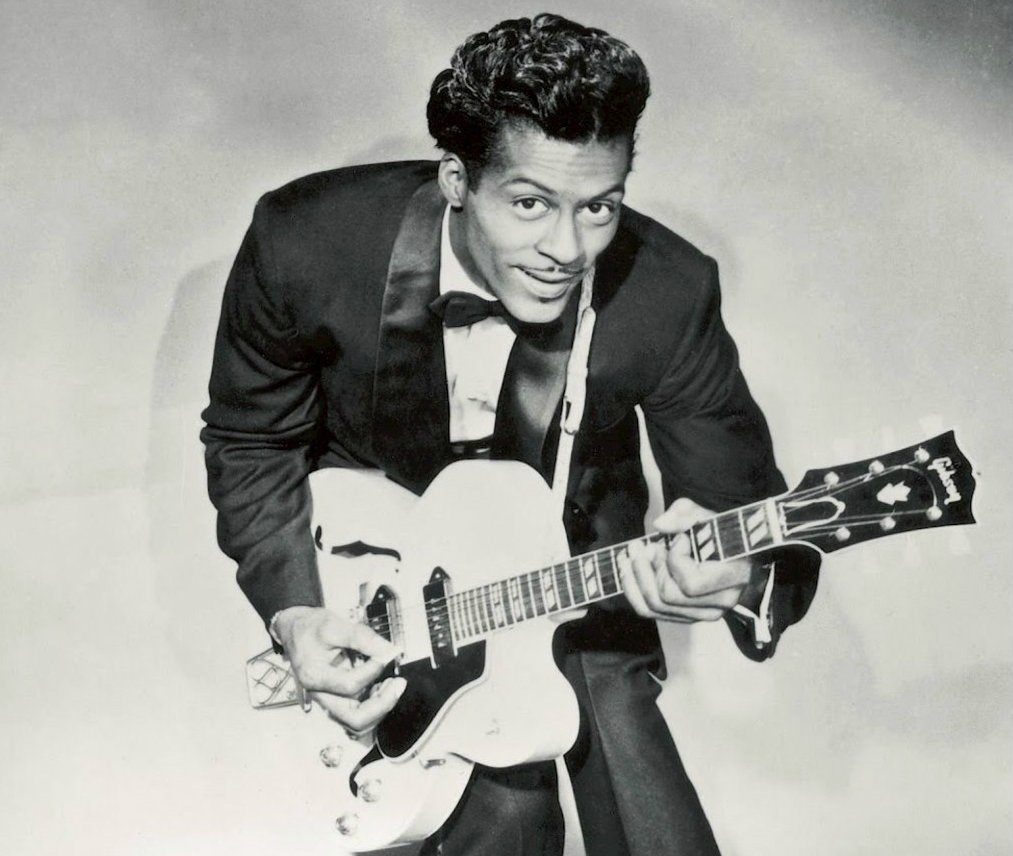 Grayscale Portrait Photo of Chuck Berry with his guitar