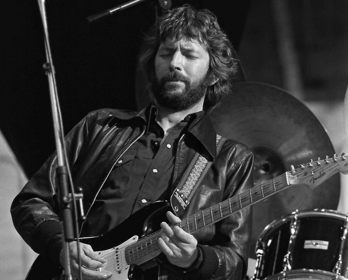Grayscale Portrait Photo of Eric Clapton performing in Rotterdam