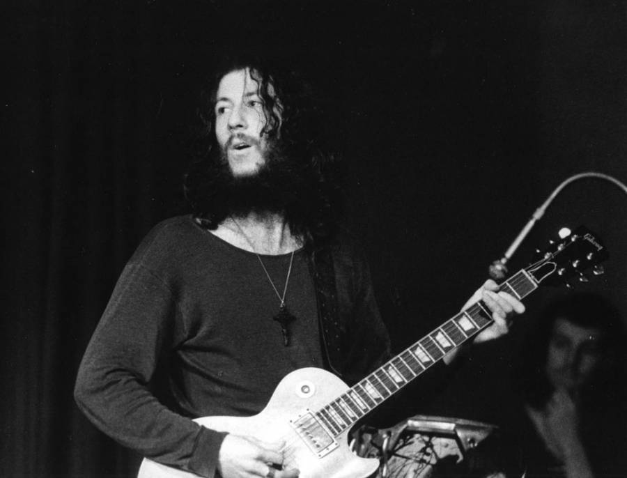 Grayscale Portrait Photo of Fleetwood Mac Peter Green performing on stage