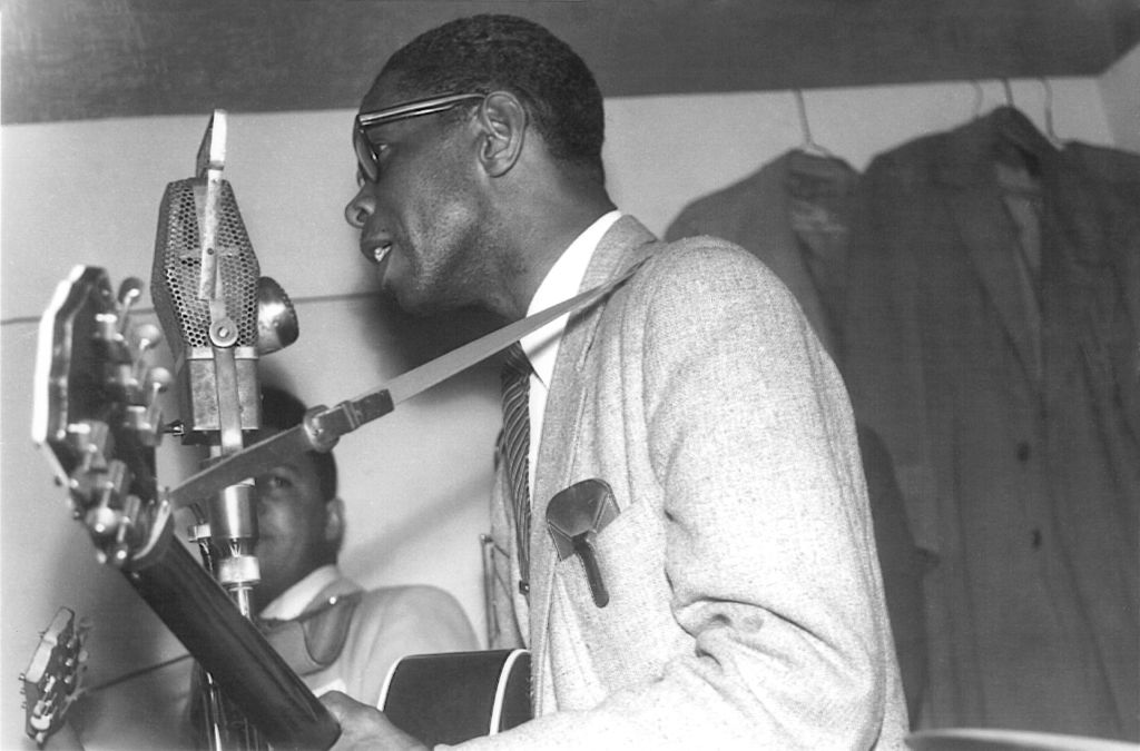 Grayscale Portrait Photo of American blues guitarist Elmore James