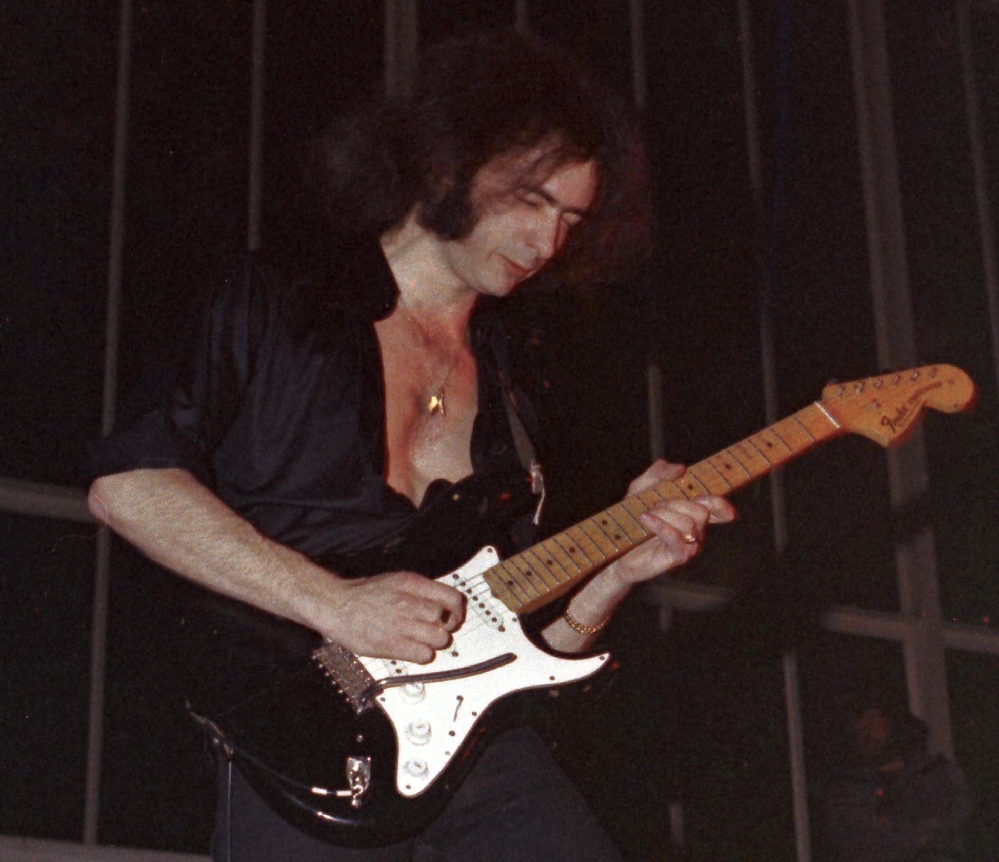 Portrait Photo of Ritchie Blackmore playing guitar on a stage